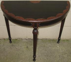 Half Moon Table With Dark Interior And Light Scalloped Frame