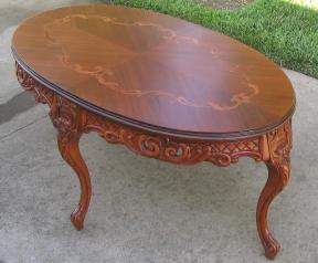 Small Oval Coffee Table With Inlay On Top And Carved Skirt